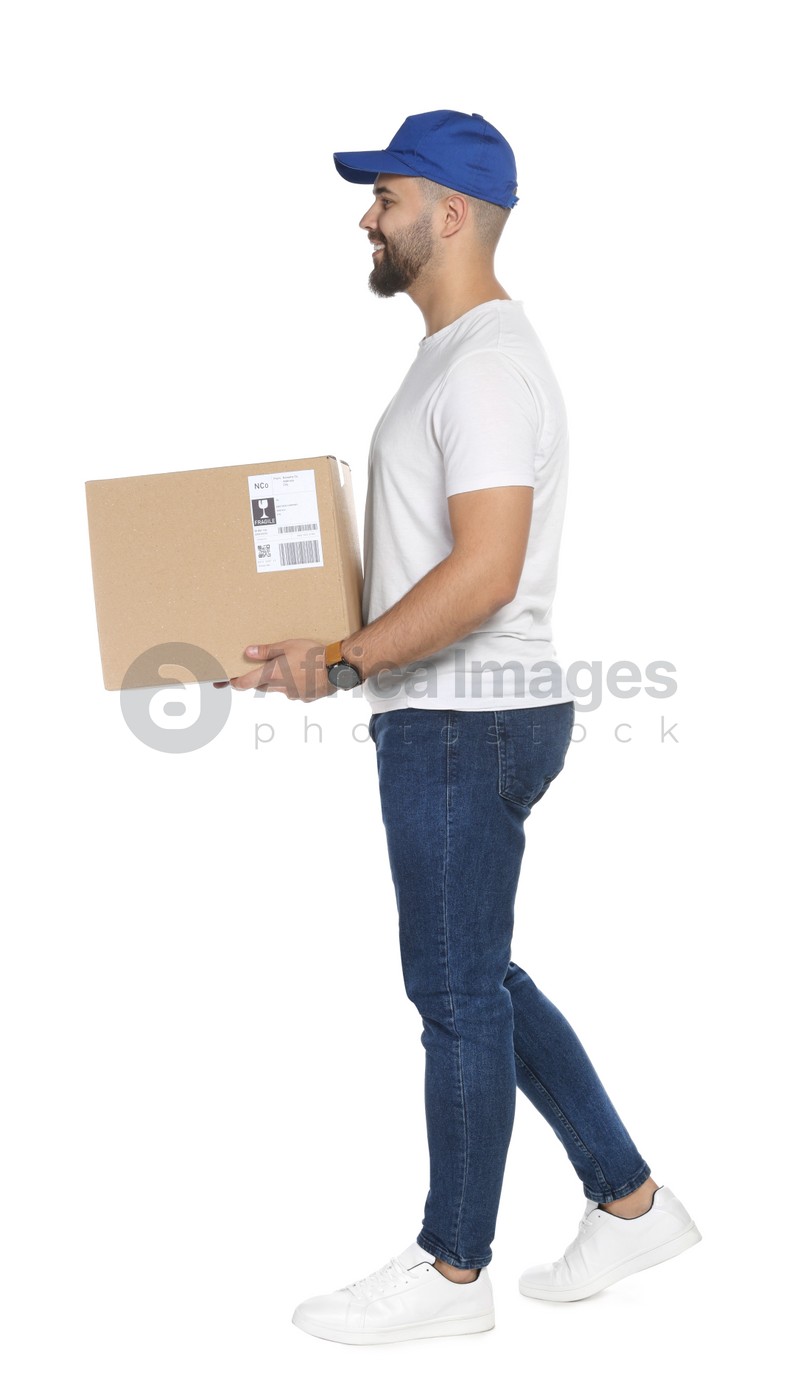 Happy young courier with cardboard box on white background