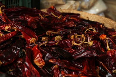 Photo of Pile of red dried guajillo peppers, closeup