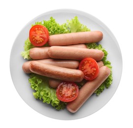 Delicious vegetarian sausages with lettuce and tomatoes on white background, top view