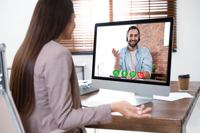 Woman using video chat for online job interview in office