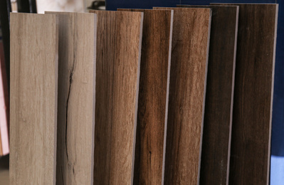 Samples of different wooden planks in store. Total wholesale