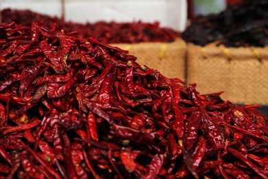 Photo of Pile of spicy dried red chili peppers at market
