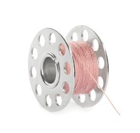 Metal spool of pink sewing thread isolated on white
