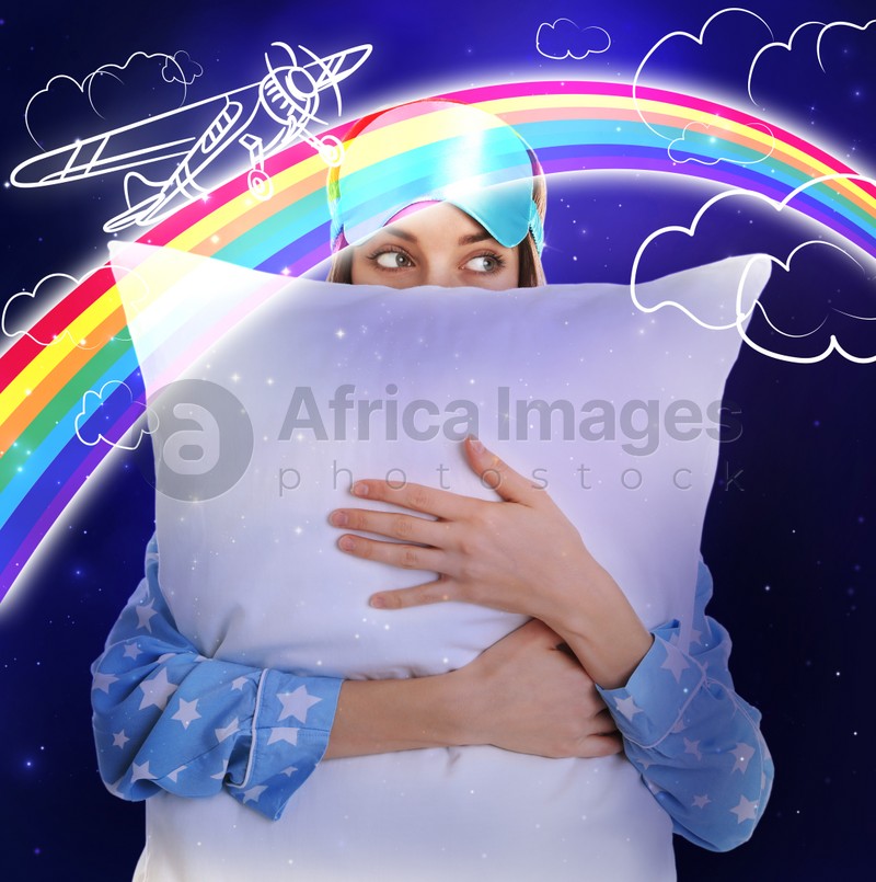 Beautiful woman in pajamas with pillow dreaming about airplane flight, night starry sky on background 