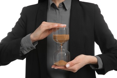 Businesswoman holding hourglass on white background, closeup. Time management