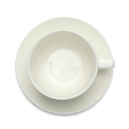 Empty cup with saucer on white background, top view