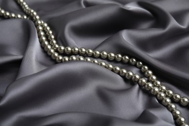 Beautiful silver pearls on delicate grey silk