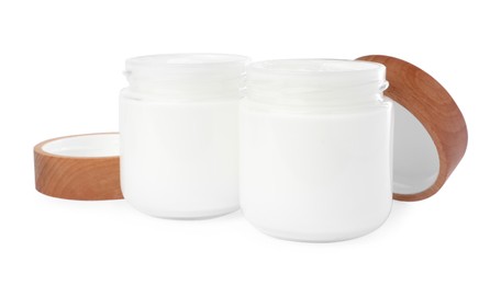 Jars of face cream isolated on white