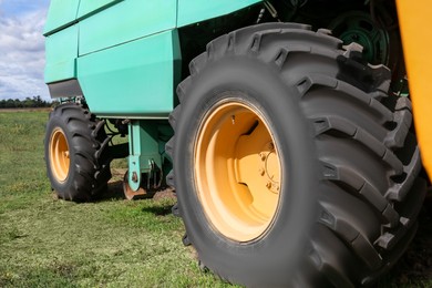Modern combine harvester wheels outdoors, closeup view