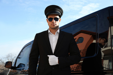 Professional driver near luxury car. Chauffeur service
