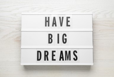 Lightbox with motivational quote Have Big Dreams on white wooden table, top view