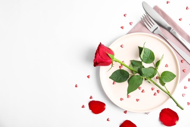 Beautiful table setting for romantic dinner on white background, flat lay. Valentine's day celebration