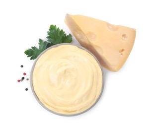 Tasty cheese, sauce, parsley and peppercorns on white background, top view