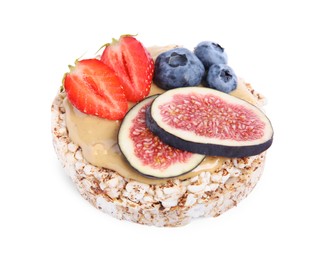 Tasty crispbread with peanut butter, berries and figs on white background