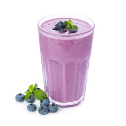Glass of blueberry smoothie with fresh berries and mint on white background