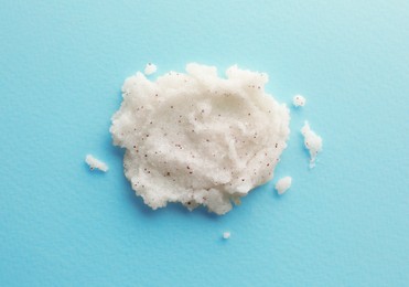 Photo of Sample of scrub on turquoise background, top view