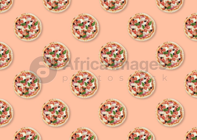 Many delicious pizzas on pink background, flat lay. Seamless pattern design