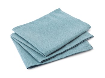 New clean light blue cloth napkins isolated on white