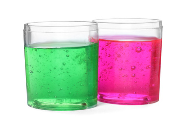 Colorful slimes in plastic containers isolated on white. Antistress toy