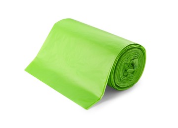 Photo of Roll of green garbage bags isolated on white
