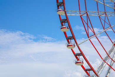 Beautiful large Ferris wheel against cloudy sky