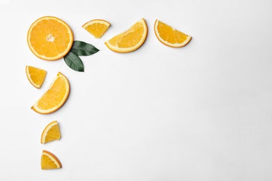 Frame made of fresh oranges on white background, top view