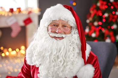 Authentic Santa Claus in traditional costume indoors
