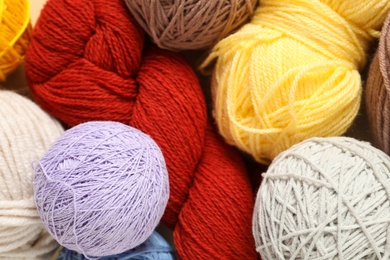 Soft colorful woolen yarns as background, closeup