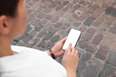 Closeup view of woman with smartphone outdoors