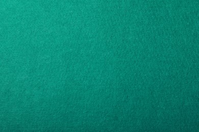 Texture of green billiard table as background, top view