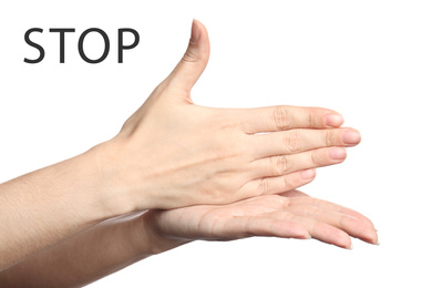 Woman showing word Stop on white background, closeup. American sign language