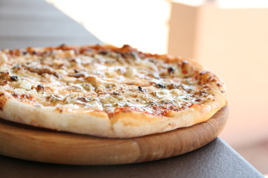 Photo of Delicious fresh pizza on table outdoors, closeup