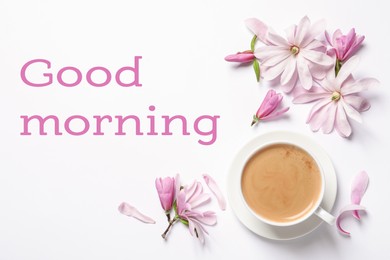 Beautiful pink magnolia flowers and cup of aromatic coffee on white background, top view. Good morning