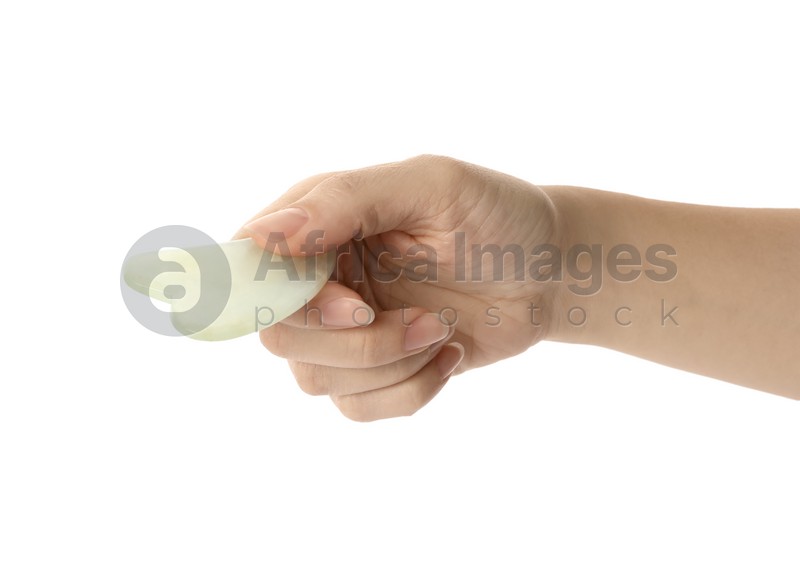 Photo of Woman with jade gua sha tool on white background, closeup