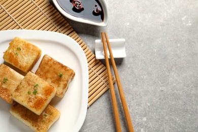 Delicious turnip cake served on grey table. Space for text