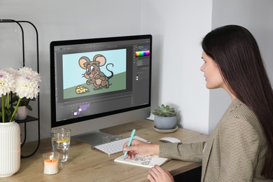 Image of Animator working at table. Modern computer with illustration on screen