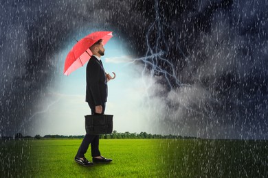 Businessman with umbrella under heavy rain. Insurance concept