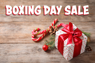 Text Boxing Day Sale and Christmas gift on wooden table