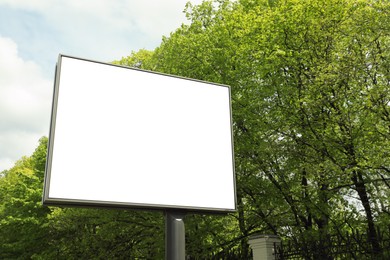 Blank advertising board in city. Mockup for design