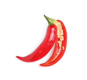 Photo of Cut red hot chili pepper on white background, top view