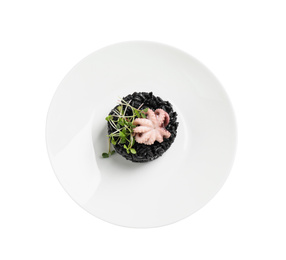 Photo of Delicious black risotto with baby octopus isolated on white, top view