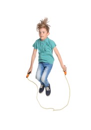 Cute little boy with jump rope on white background