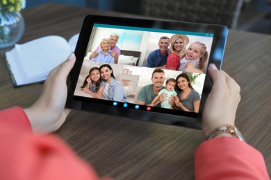 Woman having online meeting with family members via videocall application indoors, closeup