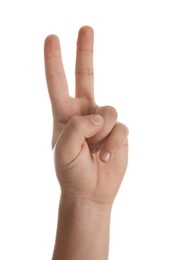 Teenage boy showing two fingers on white background, closeup