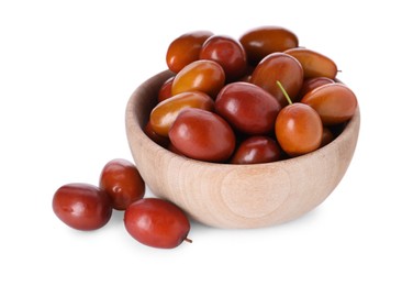 Ripe red dates in wooden bowl on white background