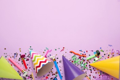 Photo of Beautiful flat lay composition with festive items on violet background, space for text. Surprise party concept