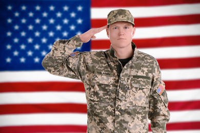 Male soldier and American flag on background. Military service