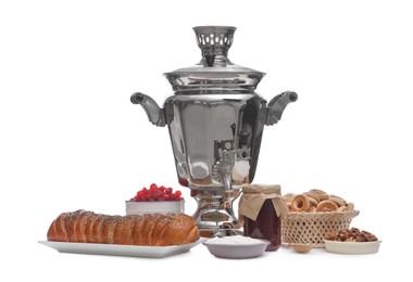 Traditional Russian samovar and treats on white background