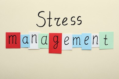 Photo of Words Stress Management on beige background, flat lay
