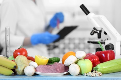 Fresh vegetables, fruits and meat on table in laboratory. Food quality control